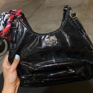 Coach purse.  Black exterior. Hot pink interior.